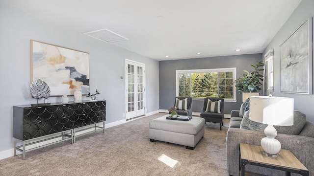 living room featuring carpet flooring, recessed lighting, and baseboards