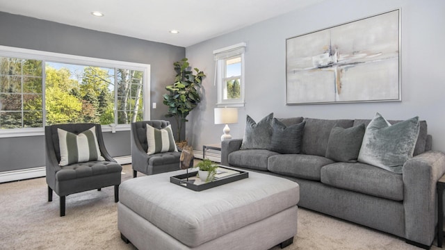carpeted living room with a baseboard radiator, baseboards, and recessed lighting