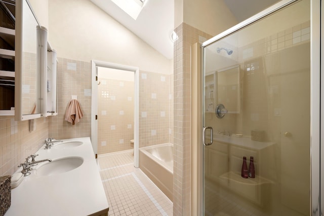 50102 Alpine Blvd, New Buffalo, MI 49117 - full bath with a skylight, a shower stall, tile walls, double vanity, and tile patterned flooring