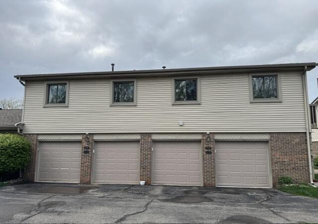 garage featuring driveway
