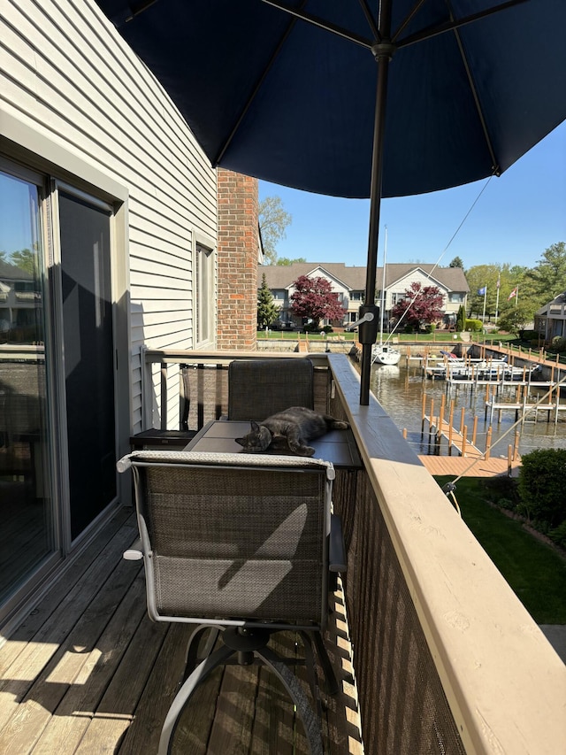 balcony featuring a water view