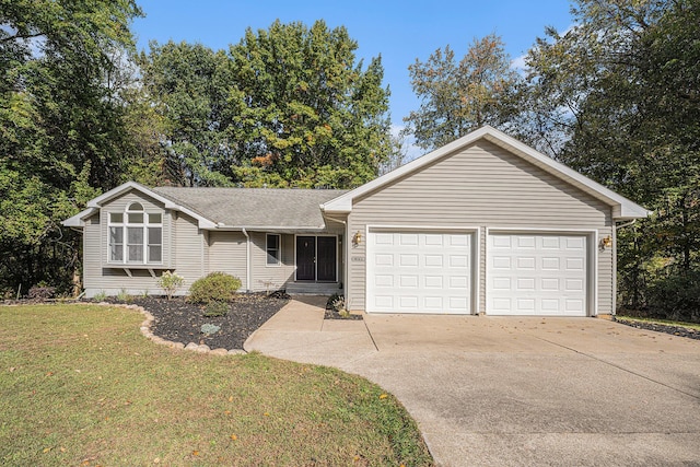 single story home featuring a front lawn, driveway, roof with shingles, and a garage