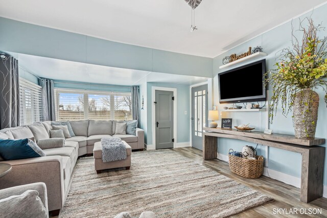 1520 Beach St, Muskegon, MI 49441 - living room featuring wood finished floors and baseboards