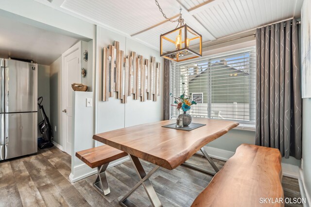 1520 Beach St, Muskegon, MI 49441 - dining room featuring wood finished floors, a chandelier, and baseboards