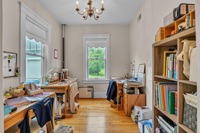 2486 Whitmore Lake Rd, Ann Arbor, MI 48105 - office space featuring a chandelier, light wood-type flooring, and baseboards