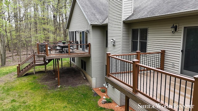 903 10 Mile Rd NW, Sparta, MI 49345 - wooden deck featuring stairway and a yard