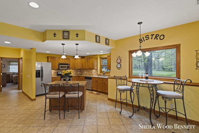 903 10 Mile Rd NW, Sparta, MI 49345 - dining space with recessed lighting, light tile patterned flooring, a chandelier, and baseboards