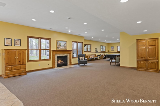 903 10 Mile Rd NW, Sparta, MI 49345 - carpeted living area featuring recessed lighting, baseboards, a fireplace with flush hearth, and healthy amount of natural light