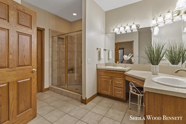 903 10 Mile Rd NW, Sparta, MI 49345 - full bathroom featuring tile patterned floors, a stall shower, vanity, and baseboards