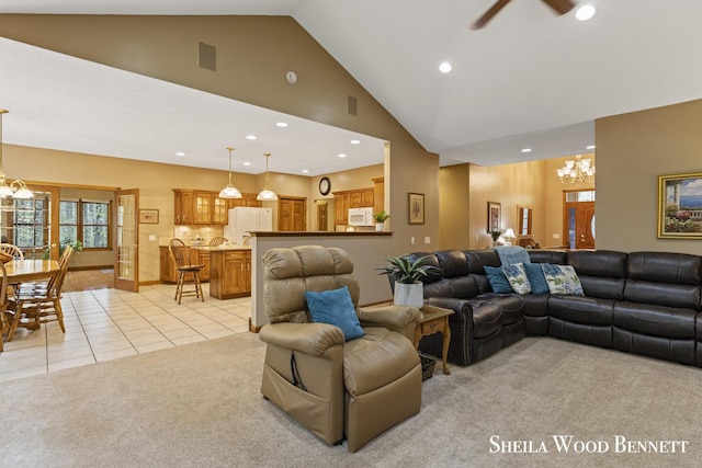 903 10 Mile Rd NW, Sparta, MI 49345 - living room with a chandelier, light carpet, recessed lighting, high vaulted ceiling, and light tile patterned floors