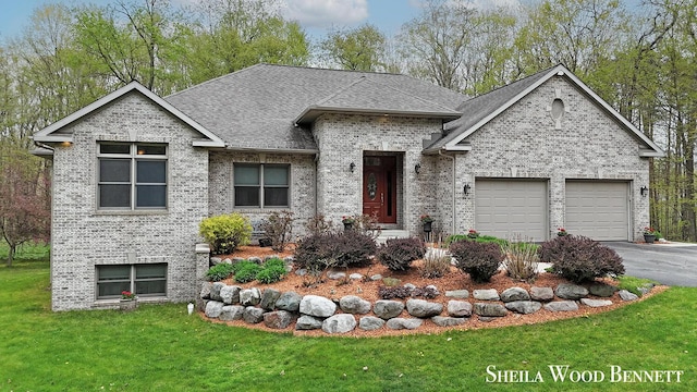 903 10 Mile Rd NW, Sparta, MI 49345 - view of front of home featuring brick siding, an attached garage, asphalt driveway, a front lawn, and roof with shingles