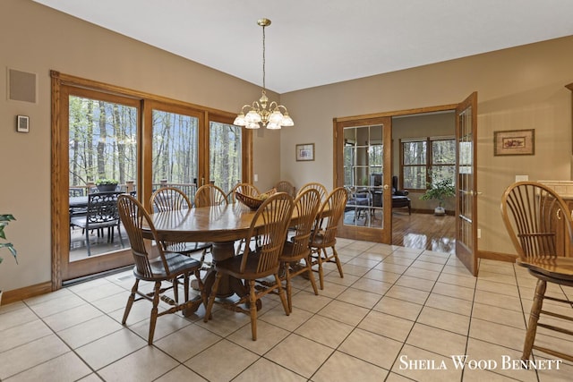 903 10 Mile Rd NW, Sparta, MI 49345 - dining room with light tile patterned floors, baseboards, french doors, and plenty of natural light