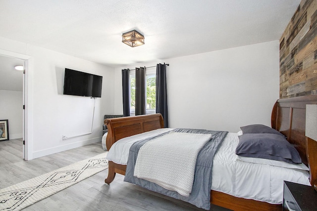 111 W 4th St, Buchanan, MI 49107 - bedroom featuring wood finished floors and baseboards