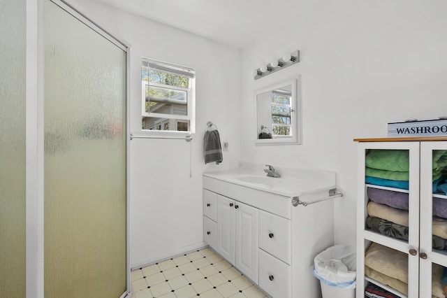 10982 Beech Is, Plainwell, MI 49080 - bathroom with tile patterned floors, vanity, and a shower stall