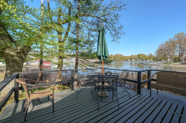 10982 Beech Is, Plainwell, MI 49080 - wooden terrace with a water view and outdoor dining space