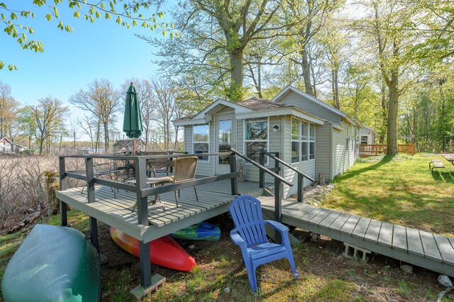 10982 Beech Is, Plainwell, MI 49080 - deck with a lawn and outdoor dining area