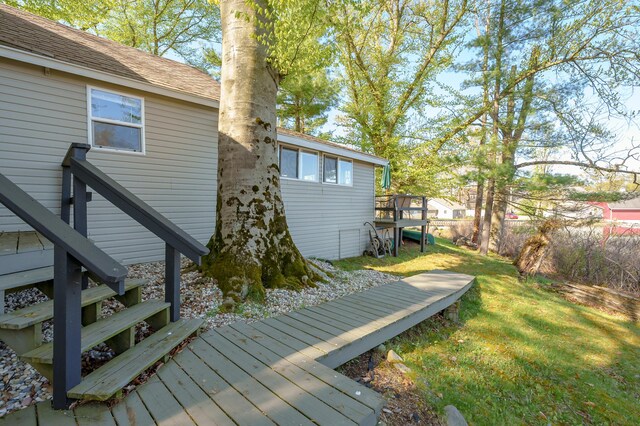 10982 Beech Is, Plainwell, MI 49080 - wooden deck featuring a lawn