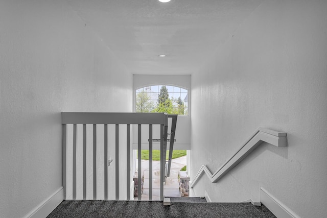 stairs with carpet flooring and baseboards