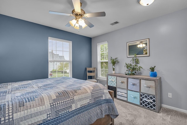 bedroom with carpet flooring, baseboards, and ceiling fan