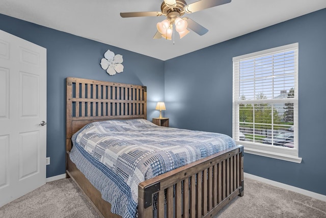 bedroom featuring carpet floors, baseboards, and a ceiling fan