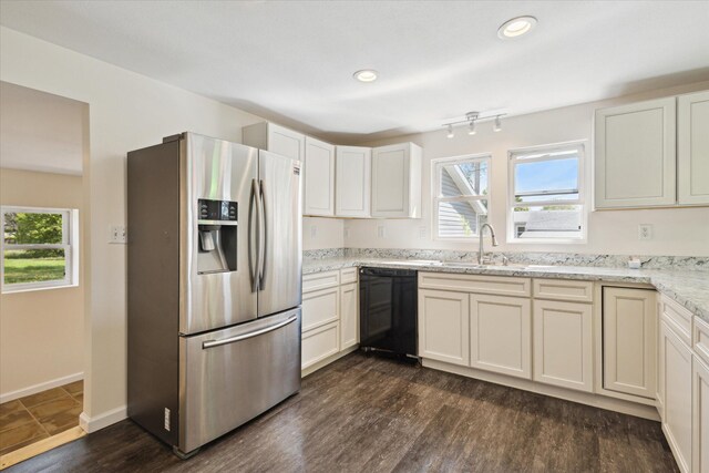 25034 Redfield St, Edwardsburg, MI 49112 - kitchen with stainless steel refrigerator with ice dispenser, black dishwasher, light stone counters, a sink, and dark wood finished floors