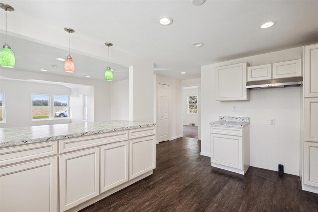 25034 Redfield St, Edwardsburg, MI 49112 - kitchen featuring dark wood finished floors, hanging light fixtures, recessed lighting, light stone countertops, and white cabinets