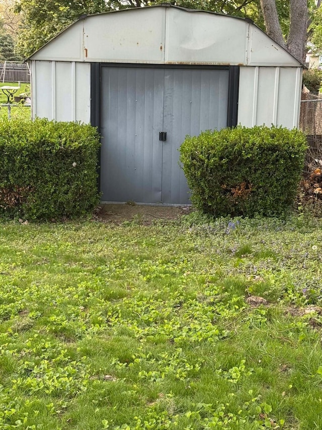 view of shed with fence