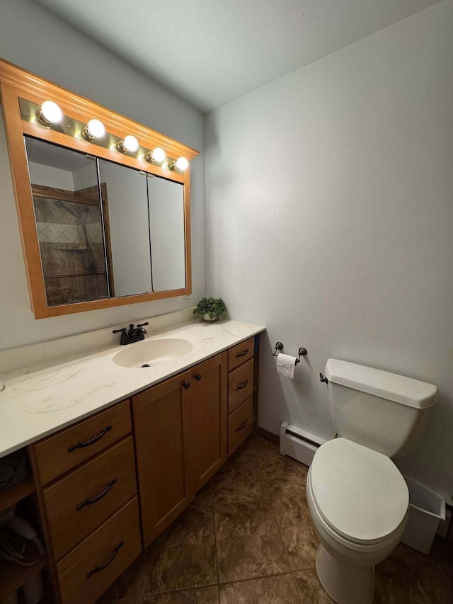 bathroom with baseboard heating, toilet, vanity, and a shower