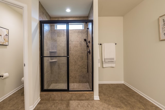2767 St Regis Way, Ann Arbor, MI 48105 - full bath with a shower stall, toilet, baseboards, and tile patterned floors