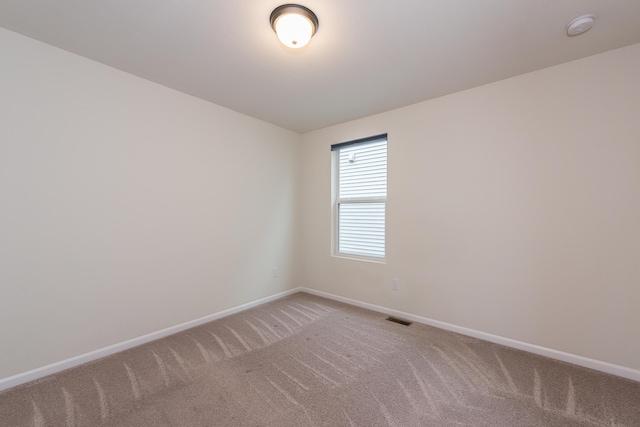 2767 St Regis Way, Ann Arbor, MI 48105 - spare room featuring light colored carpet, baseboards, and a smoke detector