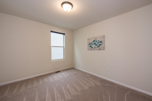 2767 St Regis Way, Ann Arbor, MI 48105 - carpeted empty room featuring baseboards