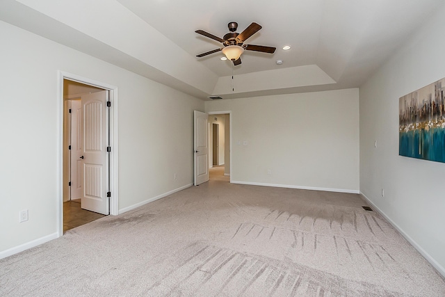 2767 St Regis Way, Ann Arbor, MI 48105 - unfurnished bedroom featuring carpet floors, a tray ceiling, baseboards, recessed lighting, and a ceiling fan