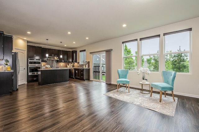 2767 St Regis Way, Ann Arbor, MI 48105 - living room with recessed lighting, dark wood-type flooring, and baseboards