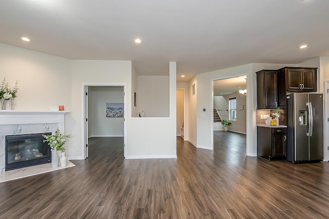 2767 St Regis Way, Ann Arbor, MI 48105 - unfurnished living room featuring dark wood-style flooring, a fireplace, baseboards, and recessed lighting