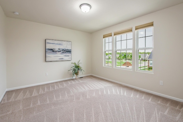 2767 St Regis Way, Ann Arbor, MI 48105 - spare room featuring carpet, baseboards, and a smoke detector
