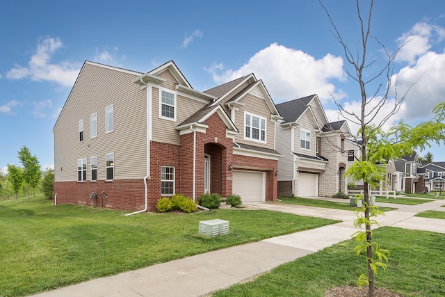 2767 St Regis Way, Ann Arbor, MI 48105 - view of front facade featuring an attached garage, concrete driveway, brick siding, and a front yard