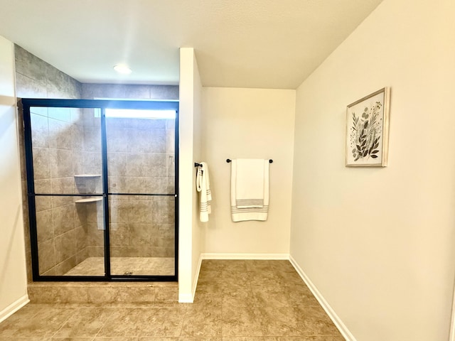 2767 St Regis Way, Ann Arbor, MI 48105 - bathroom featuring a shower stall, baseboards, and tile patterned flooring