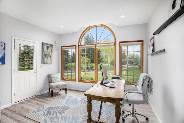 home office with baseboards, light wood finished floors, and recessed lighting