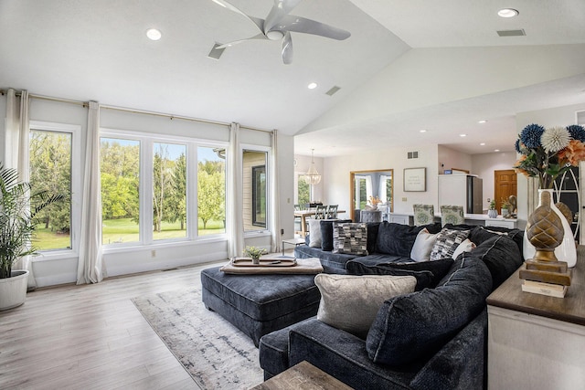 living room featuring a ceiling fan, recessed lighting, light wood-type flooring, and high vaulted ceiling