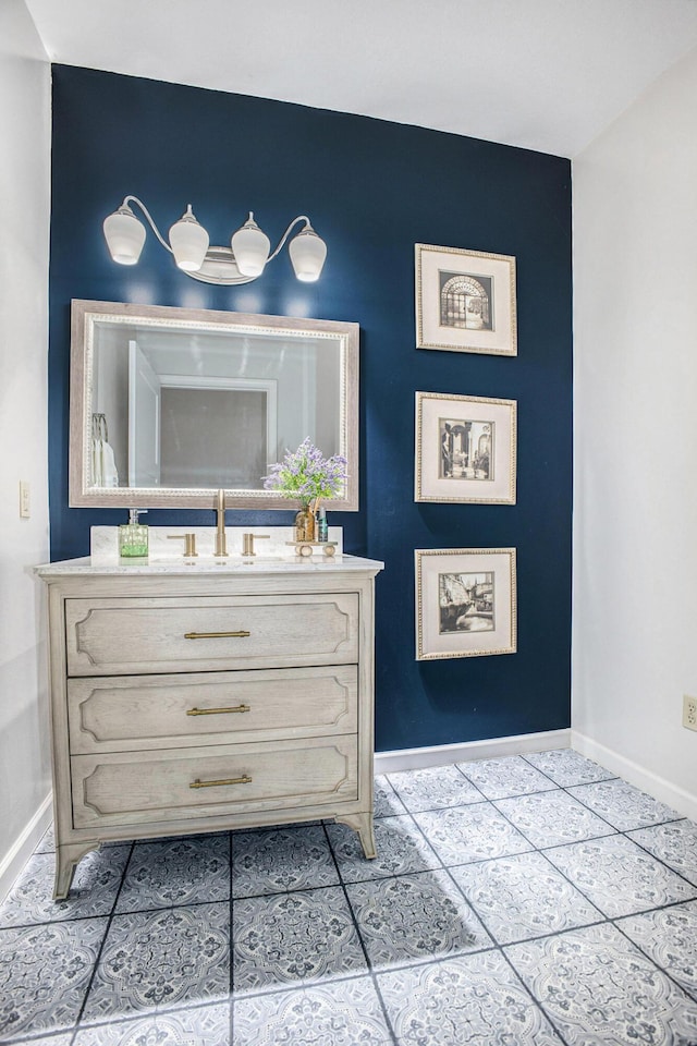 detailed view of baseboards and vanity