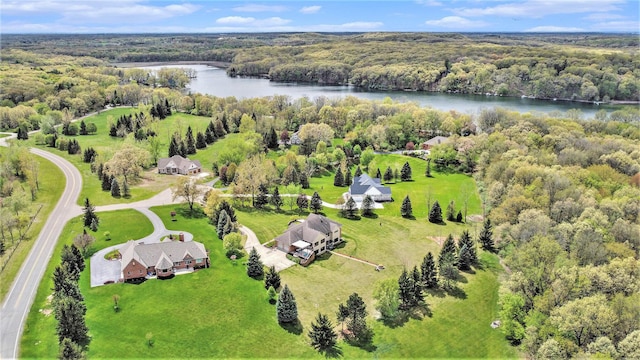 aerial view of a large body of water and a heavily wooded area