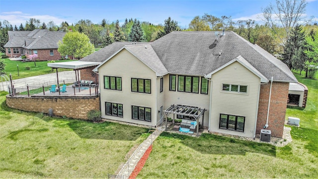 rear view of property with a patio, central AC, and roof with shingles