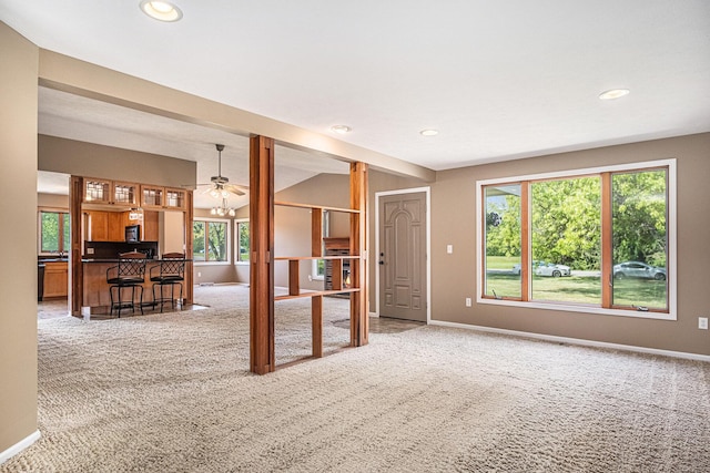 11630 Myers Lake Ave NE, Cedar Springs, MI 49319 - living area featuring light carpet, baseboards, recessed lighting, and lofted ceiling