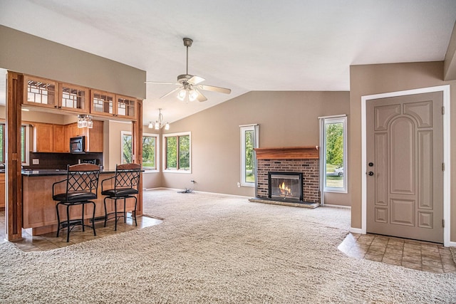11630 Myers Lake Ave NE, Cedar Springs, MI 49319 - living room with carpet, ceiling fan, lofted ceiling, a chandelier, and baseboards