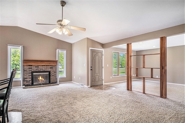 11630 Myers Lake Ave NE, Cedar Springs, MI 49319 - unfurnished living room featuring carpet floors, a ceiling fan, vaulted ceiling, baseboards, and a brick fireplace
