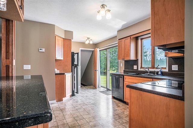 11630 Myers Lake Ave NE, Cedar Springs, MI 49319 - kitchen with black appliances, a sink, dark countertops, baseboards, and brown cabinets