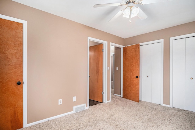 11630 Myers Lake Ave NE, Cedar Springs, MI 49319 - unfurnished bedroom with carpet floors, two closets, and ceiling fan