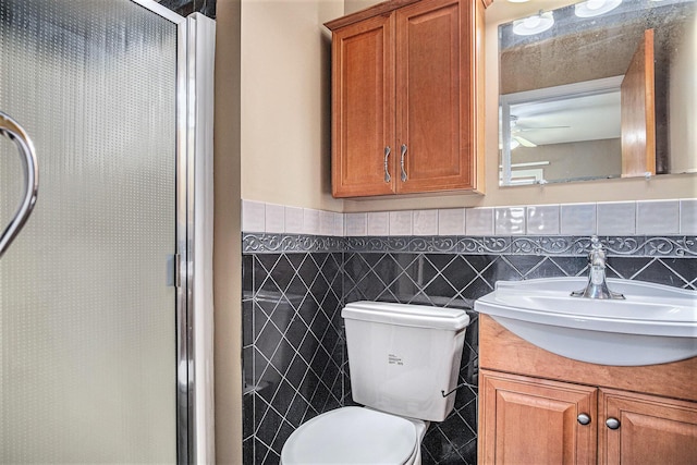 11630 Myers Lake Ave NE, Cedar Springs, MI 49319 - full bathroom with vanity, a stall shower, toilet, and tile walls