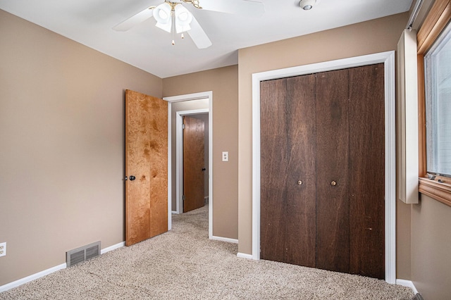 11630 Myers Lake Ave NE, Cedar Springs, MI 49319 - unfurnished bedroom featuring carpet, a closet, baseboards, and ceiling fan