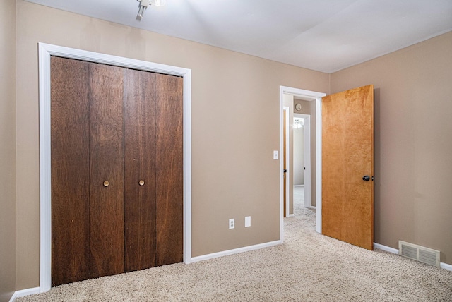 11630 Myers Lake Ave NE, Cedar Springs, MI 49319 - unfurnished bedroom with carpet floors, baseboards, and a closet